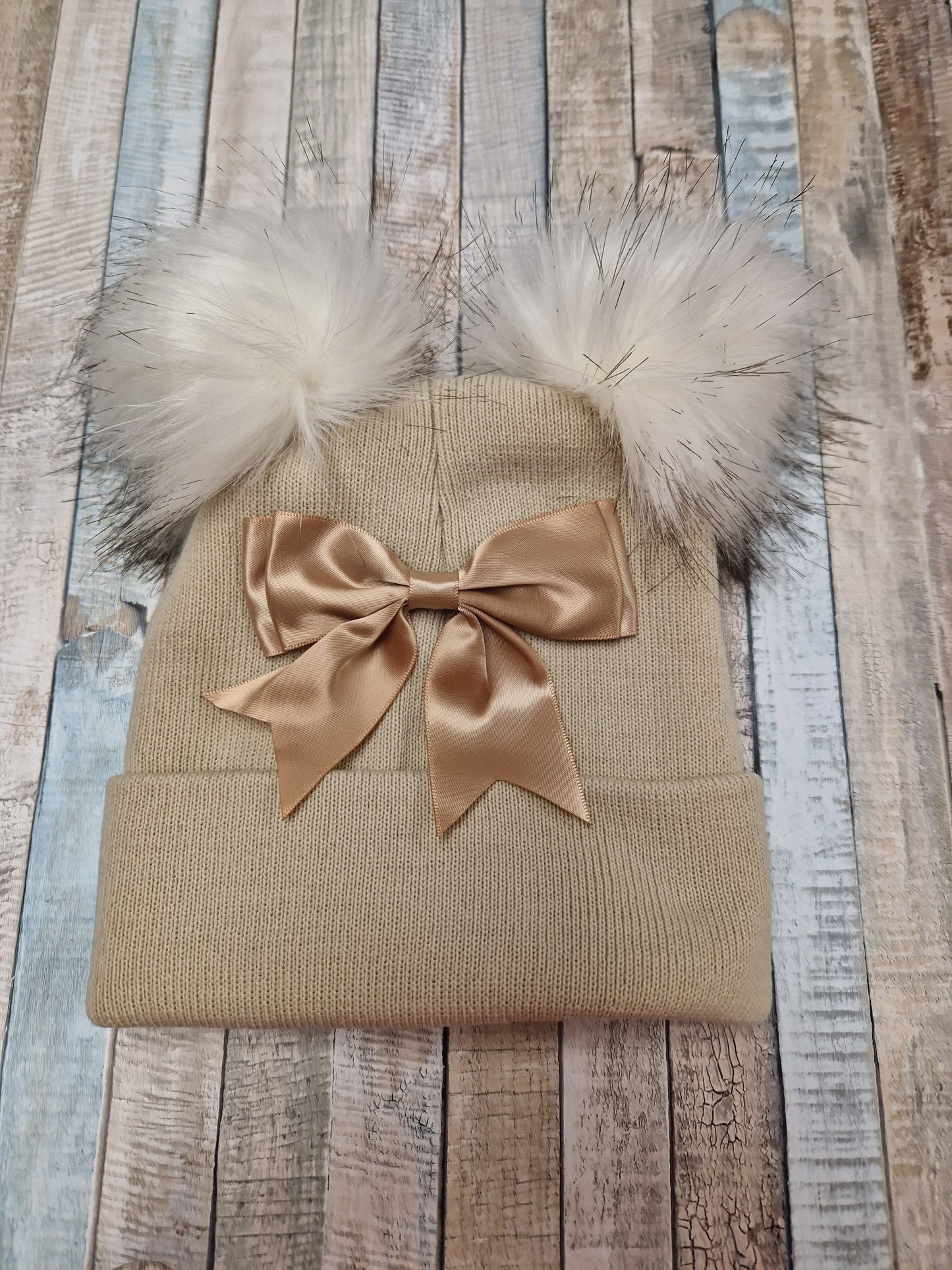 Baby Girls Beige And Gold Bow And Fluffy Double Pom Hat