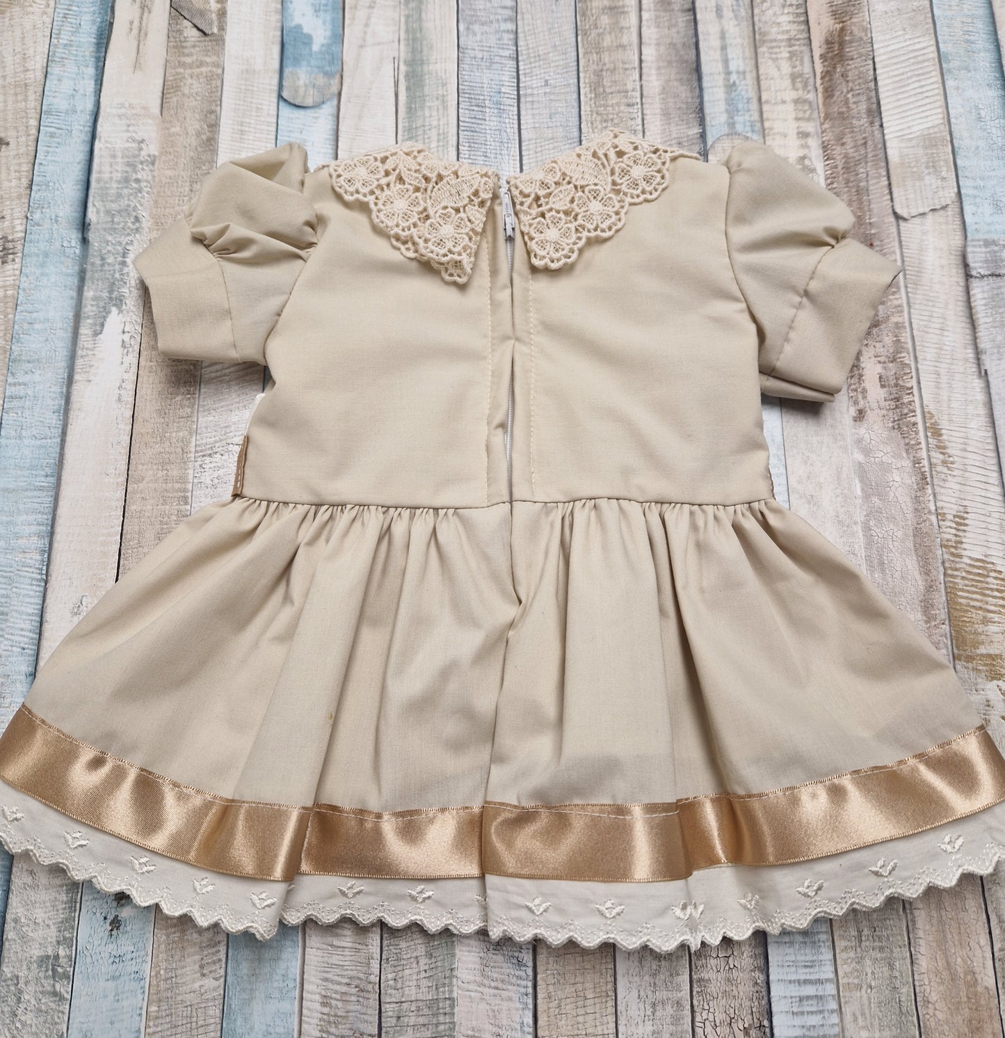 Baby Girls Beige Dress With Gold Satin Bow And Cream Lace Collar