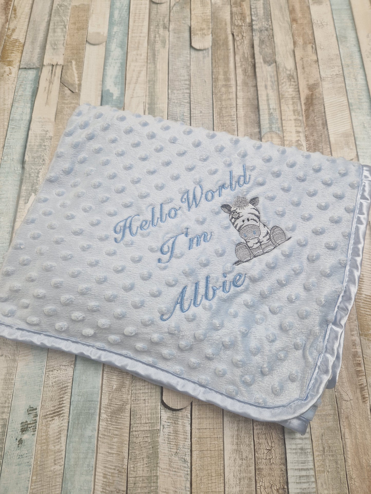 Personalised Hello World Blue Dimple Wrap With Blue Zebra Embroidered Design