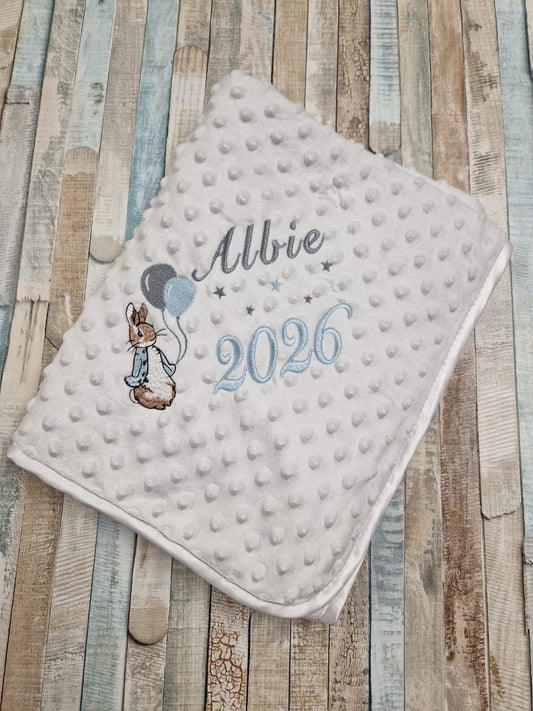 Personalised Baby Boys White Dimple Wrap With Blue Rabbit And Balloons And Year Of Birth