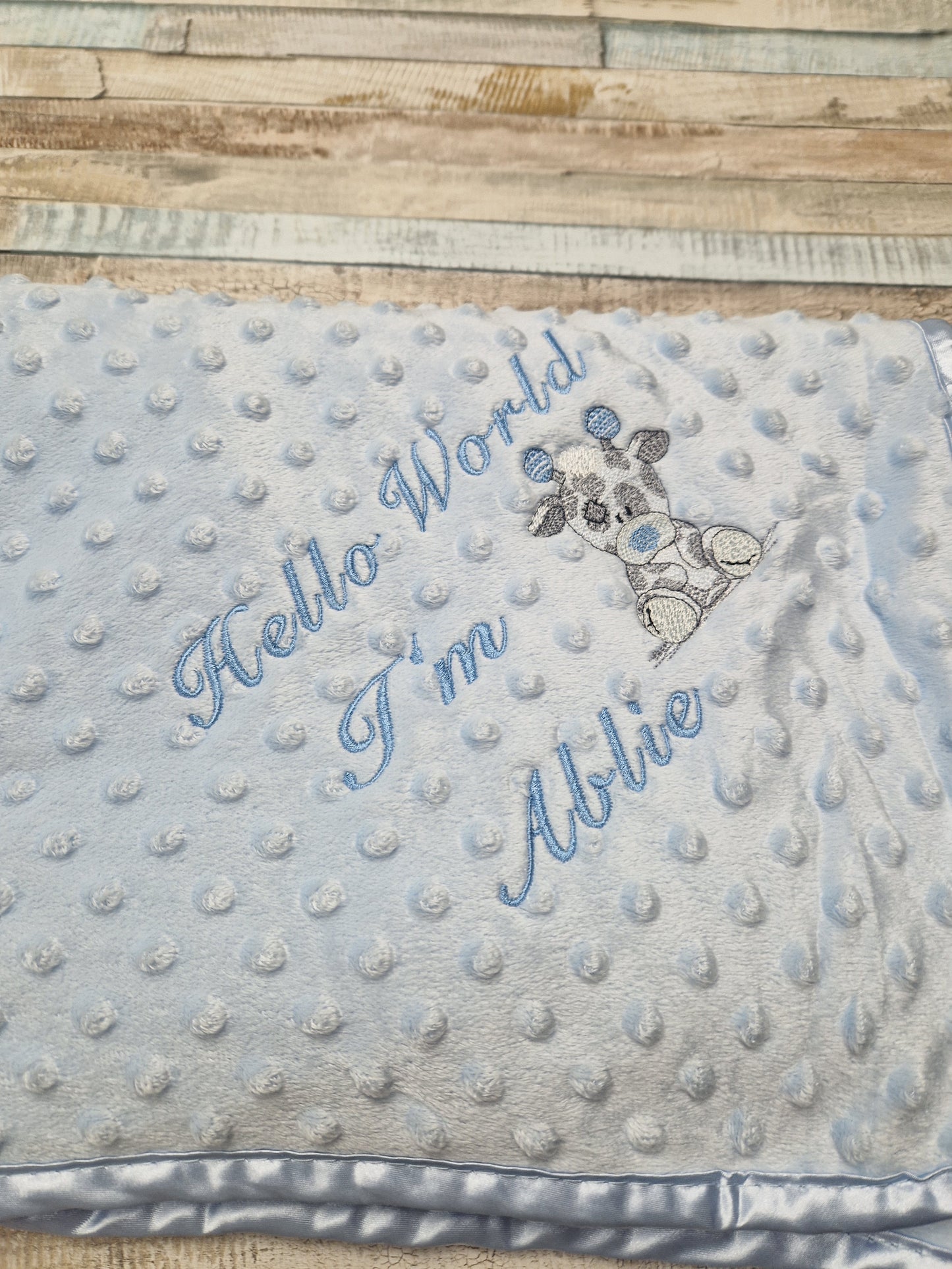 Personalised Hello World Blue Dimple Wrap With Blue Giraffe Embroidered Design