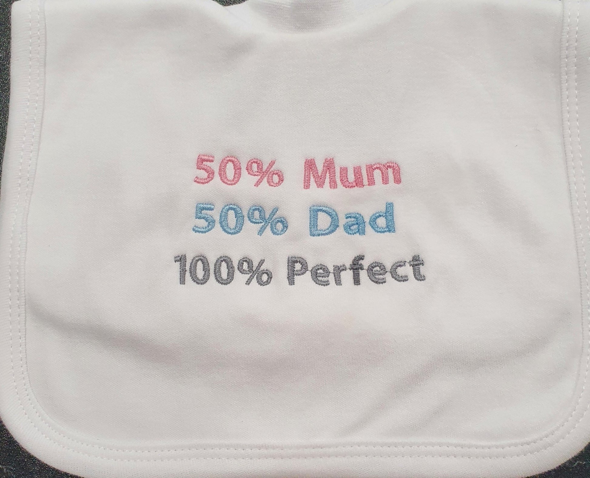50% Mum 50% Dad 100% Perfect White Pull On Bib - Nana B Baby & Childrenswear Boutique