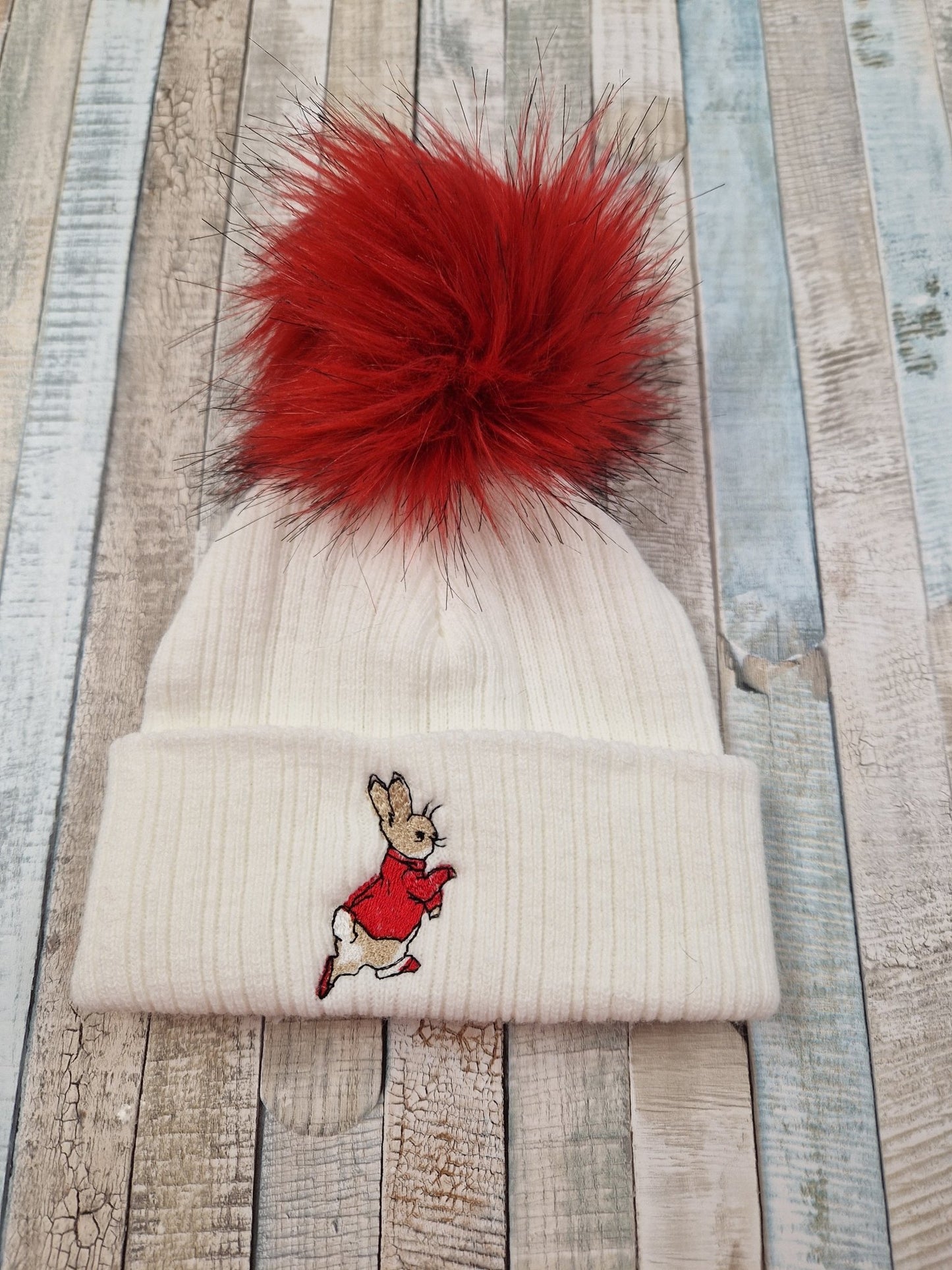 White & Red Rabbit Hat With Fluffy Red Faux Fur Pom - Nana B Baby & Childrenswear Boutique